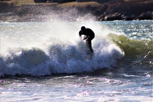 surfer on a wave in narragansett
